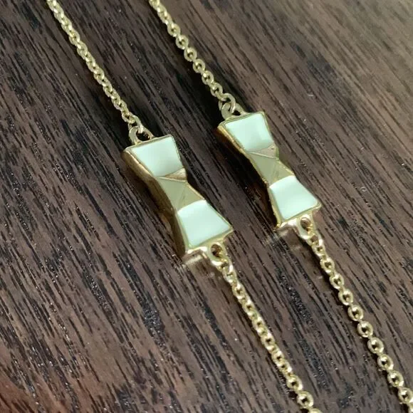 KATE Spade enamel/gold bow gold tone chain necklace